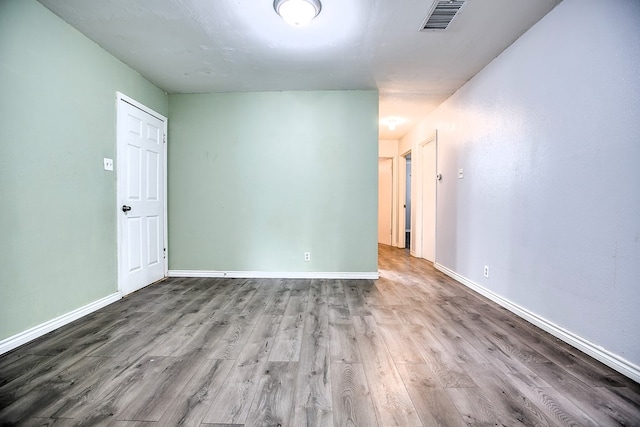 136 Arlington St, San Angelo, TX 76903 - spare room with wood finished floors and baseboards