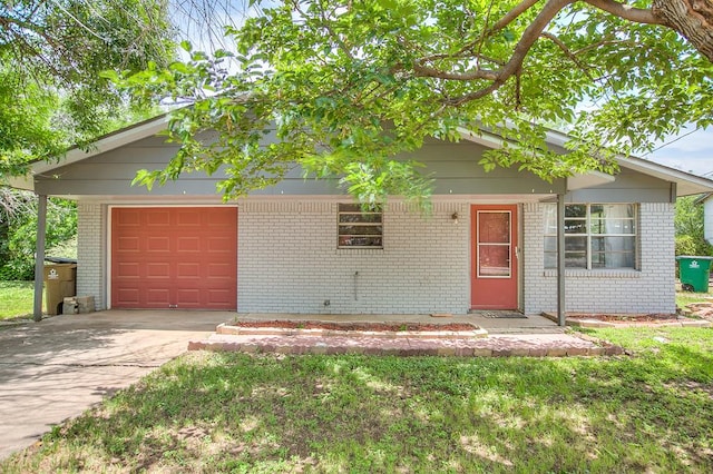 136 Arlington St, San Angelo, TX 76903 - single story home with brick siding, a garage, and concrete driveway