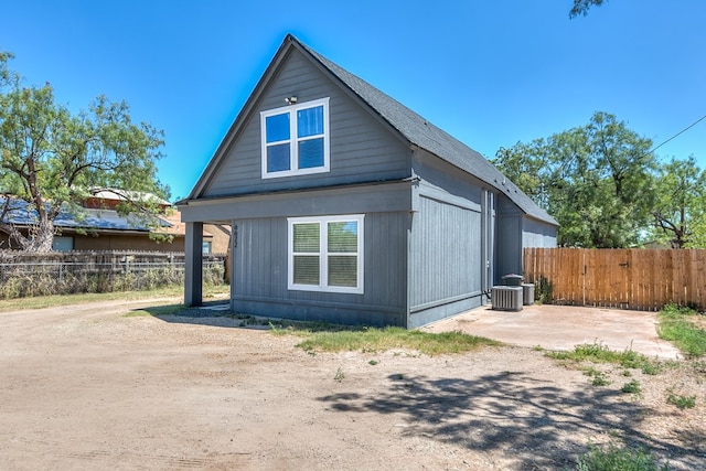 6622 Knickerbocker Rd, San Angelo, TX 76904 - view of side of property featuring fence and central AC