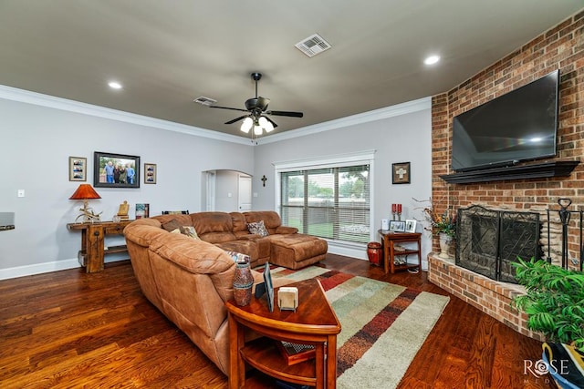 5531 Woodbine Ln, San Angelo, TX 76904 - living area with wood finished floors, a fireplace, ceiling fan, baseboards, and ornamental molding