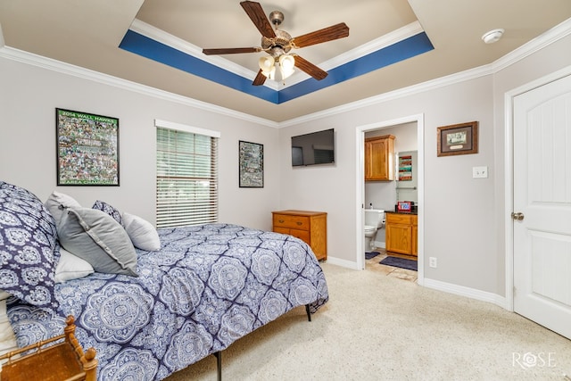 5531 Woodbine Ln, San Angelo, TX 76904 - bedroom featuring a tray ceiling, light colored carpet, ornamental molding, baseboards, and ensuite bath