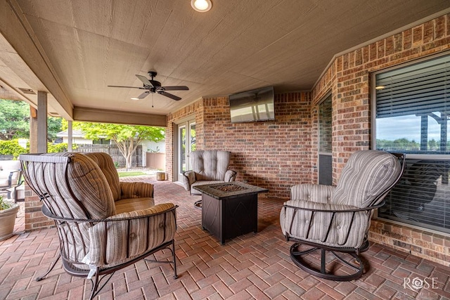 5531 Woodbine Ln, San Angelo, TX 76904 - view of patio / terrace featuring fence, ceiling fan, and an outdoor living space with a fire pit