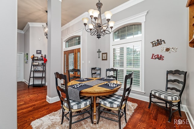 5531 Woodbine Ln, San Angelo, TX 76904 - dining space with french doors, a chandelier, crown molding, wood finished floors, and baseboards