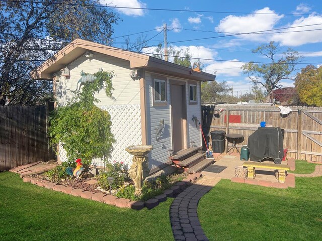 view of outdoor structure with a lawn