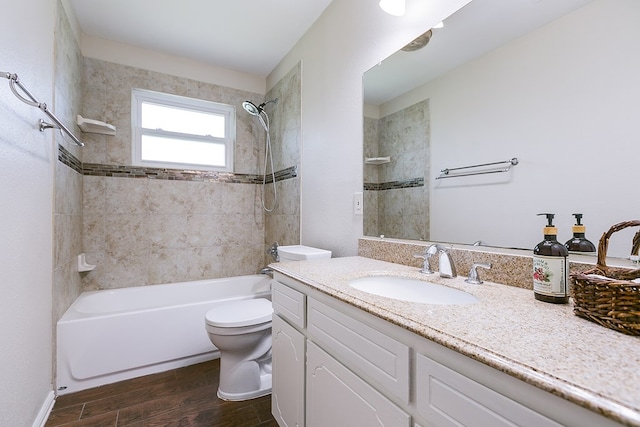 3868 Honeysuckle Ln, San Angelo, TX 76904 - bathroom with wood finished floors, toilet, shower / bathtub combination, and vanity