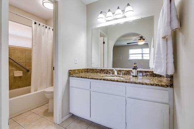 3868 Honeysuckle Ln, San Angelo, TX 76904 - bathroom featuring tile patterned flooring, vanity, a ceiling fan, toilet, and shower / bath combination with curtain