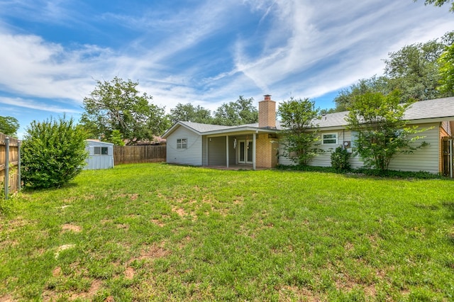 3868 Honeysuckle Ln, San Angelo, TX 76904 - back of property with a chimney