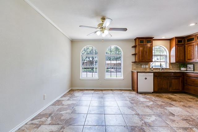 3868 Honeysuckle Ln, San Angelo, TX 76904 - kitchen with white dishwasher, plenty of natural light, a ceiling fan, tasteful backsplash, and crown molding