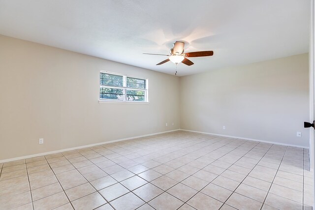 3868 Honeysuckle Ln, San Angelo, TX 76904 - unfurnished room featuring ceiling fan, light tile patterned flooring, and baseboards