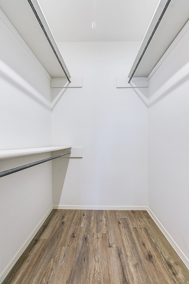 3868 Honeysuckle Ln, San Angelo, TX 76904 - walk in closet featuring wood finished floors