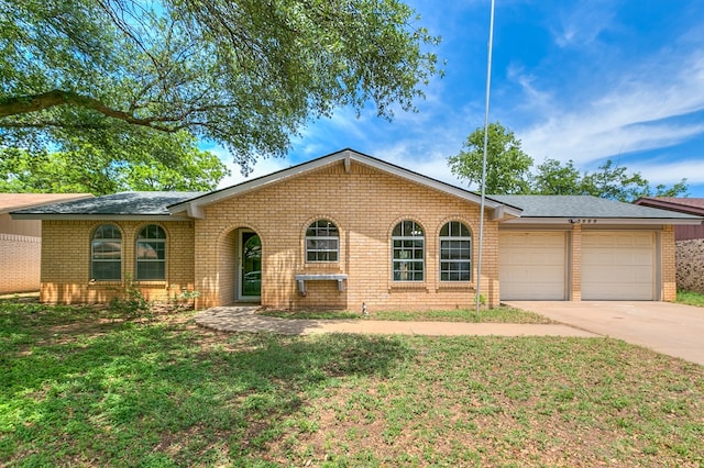 3868 Honeysuckle Ln, San Angelo, TX 76904 - ranch-style house featuring a garage, brick siding, concrete driveway, roof with shingles, and a front yard