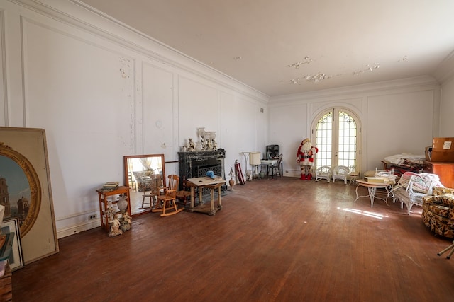 miscellaneous room featuring dark hardwood / wood-style flooring, crown molding, and french doors