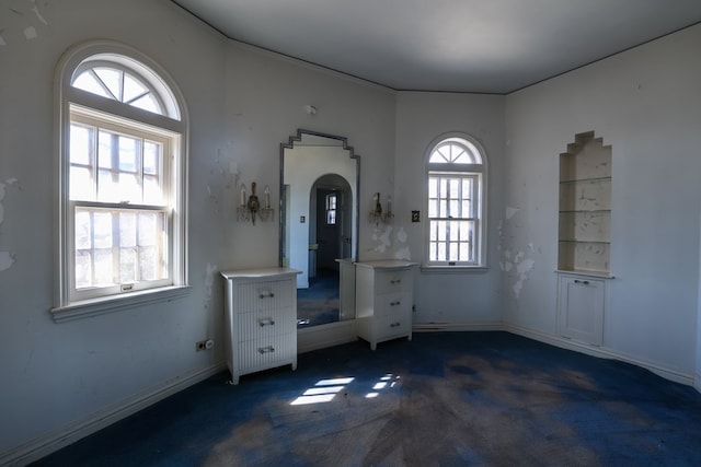 interior space featuring dark colored carpet