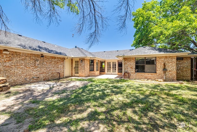 3413 Sequoia Cir, San Angelo, TX 76904 - back of house with french doors, brick siding, a yard, and a patio