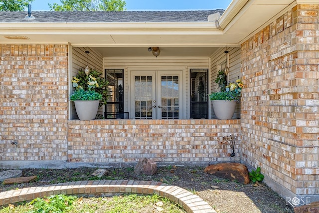 3413 Sequoia Cir, San Angelo, TX 76904 - entrance to property featuring french doors, a shingled roof, and brick siding