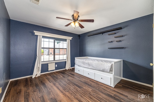 3413 Sequoia Cir, San Angelo, TX 76904 - unfurnished bedroom with baseboards, wood finished floors, a ceiling fan, and a textured wall