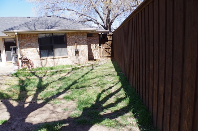 view of yard featuring a gate and fence