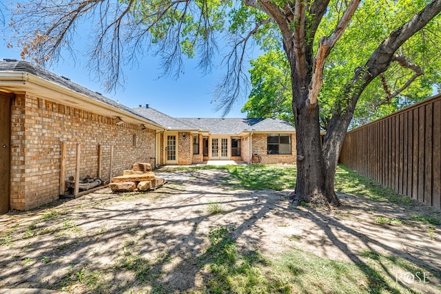 3413 Sequoia Cir, San Angelo, TX 76904 - back of property featuring french doors, brick siding, and a patio
