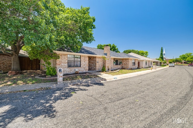 3413 Sequoia Cir, San Angelo, TX 76904 - single story home with a chimney and brick siding
