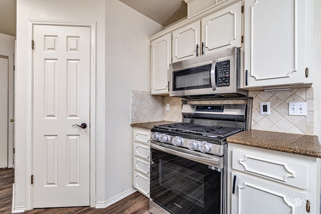 3413 Sequoia Cir, San Angelo, TX 76904 - kitchen featuring appliances with stainless steel finishes, dark wood-style flooring, white cabinetry, and backsplash