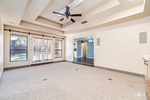 3413 Sequoia Cir, San Angelo, TX 76904 - carpeted empty room with a tray ceiling, baseboards, a chandelier, and a ceiling fan