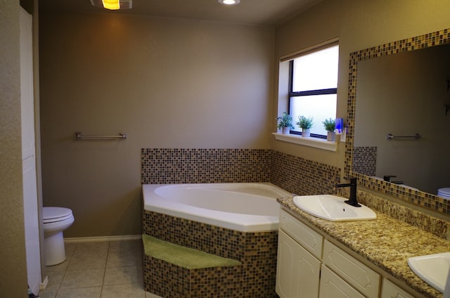 full bath with toilet, double vanity, a bath, tile patterned floors, and a sink