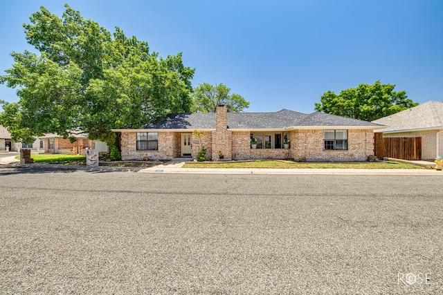 3413 Sequoia Cir, San Angelo, TX 76904 - ranch-style house with a chimney and brick siding