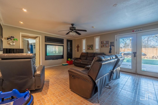 living room with crown molding, ceiling fan, and french doors