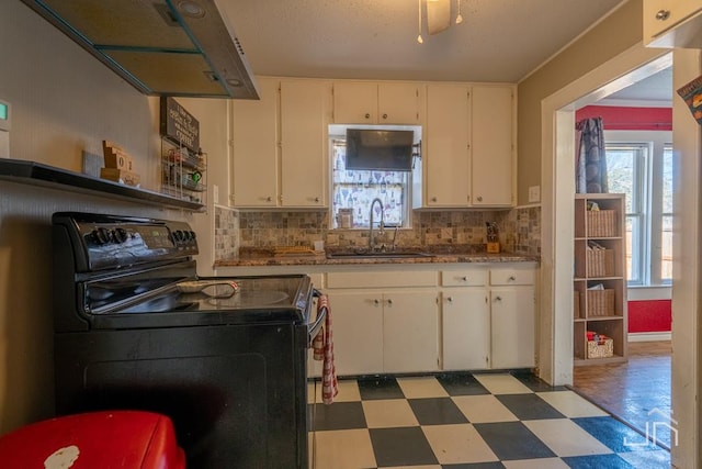 kitchen featuring white cabinetry, sink, decorative backsplash, and black electric range oven