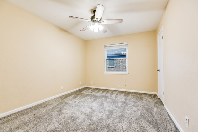 empty room with ceiling fan and carpet flooring