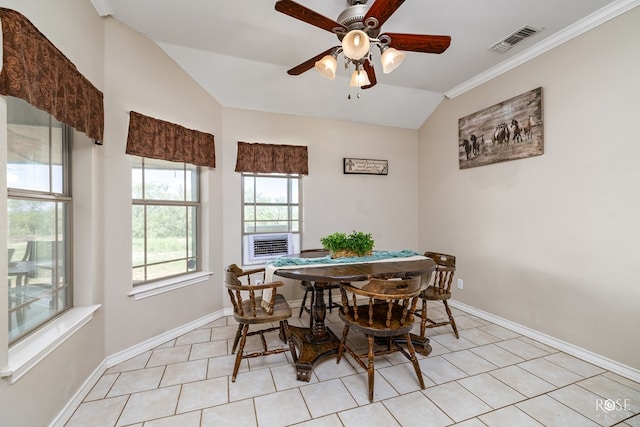 dining room with vaulted ceiling, crown molding, light tile patterned floors, and ceiling fan