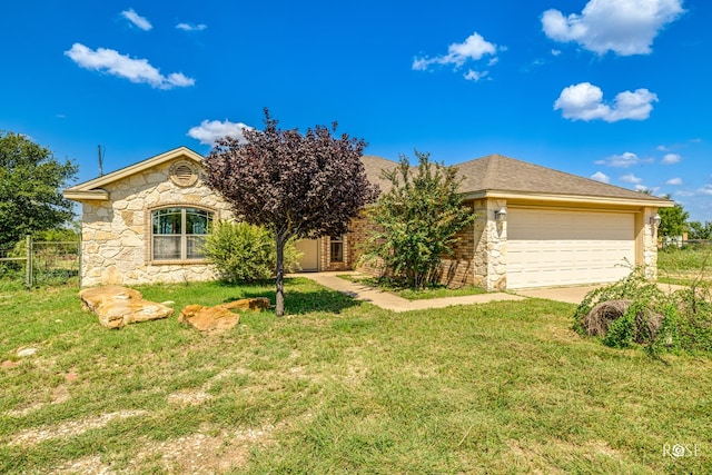 view of front of house with a garage and a front yard