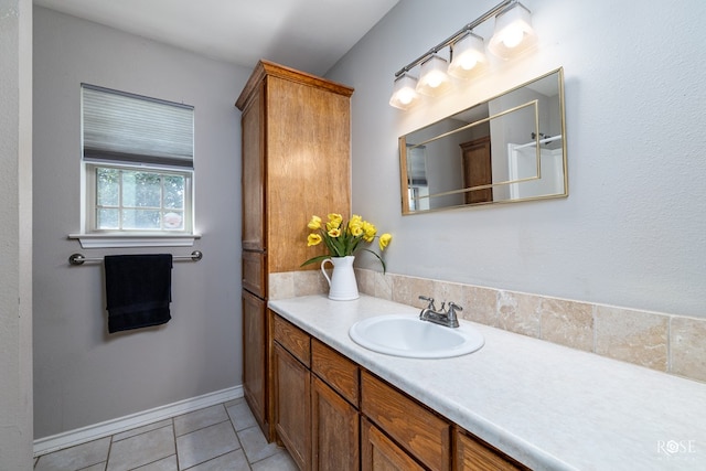 bathroom featuring tile patterned flooring and vanity