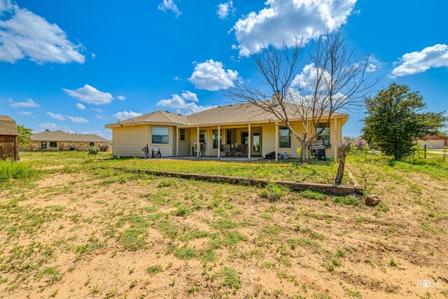 back of property with a patio area