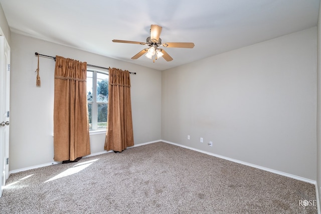 empty room featuring ceiling fan and carpet flooring