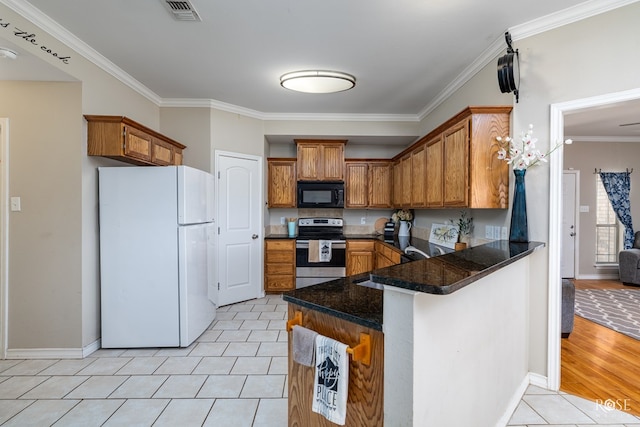 kitchen featuring light tile patterned flooring, sink, stainless steel range with electric cooktop, kitchen peninsula, and white fridge