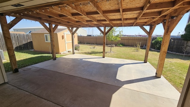 view of patio featuring a shed