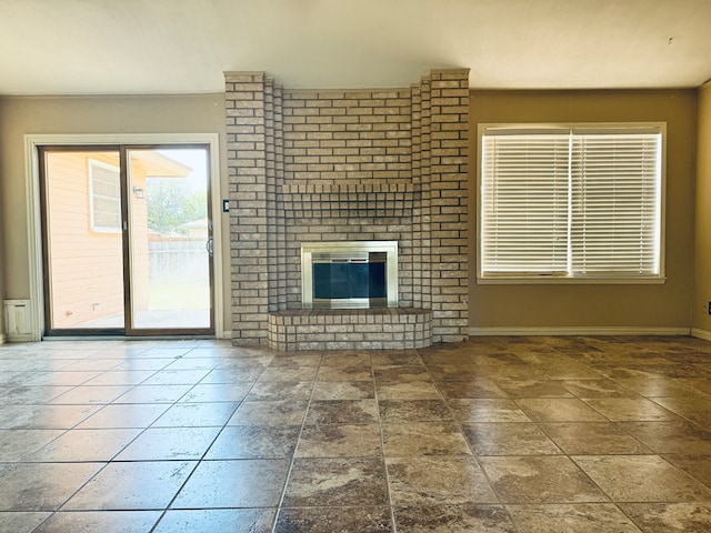 unfurnished living room featuring a fireplace