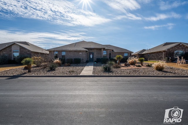 view of front of home featuring brick siding