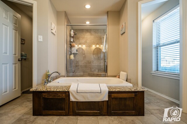 full bath featuring recessed lighting, a garden tub, baseboards, and tiled shower