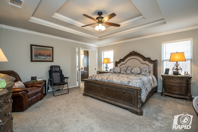 bedroom with ornamental molding, a raised ceiling, ceiling fan, and carpet