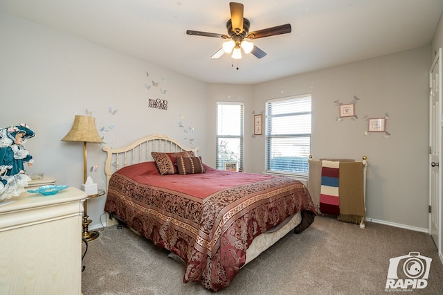 bedroom featuring ceiling fan and carpet