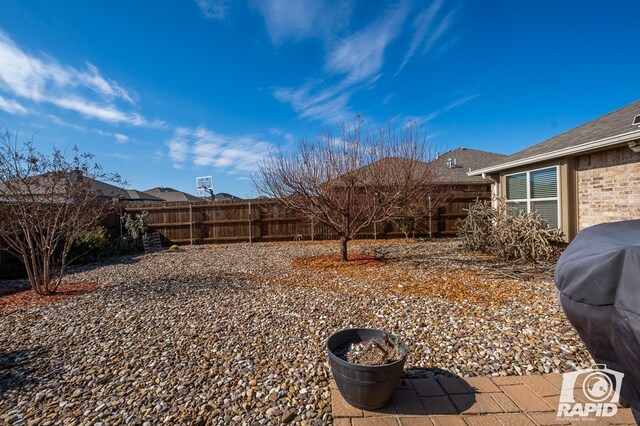 view of yard with a fenced backyard