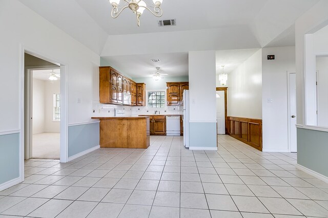 kitchen featuring dishwasher, ceiling fan with notable chandelier, visible vents, and brown cabinets