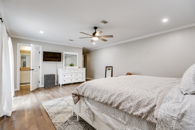 bedroom with visible vents, ceiling fan, ornamental molding, wood finished floors, and recessed lighting