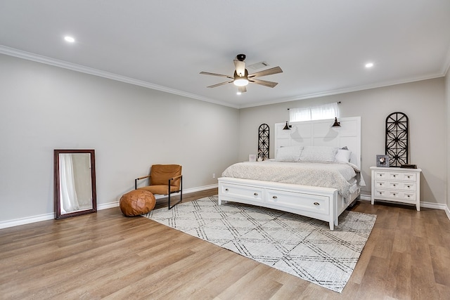 bedroom with ornamental molding, a ceiling fan, baseboards, and wood finished floors