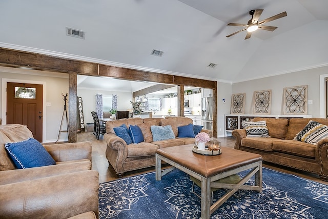 living area featuring ceiling fan, visible vents, and ornamental molding