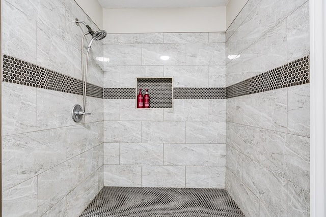 bathroom with a tile shower