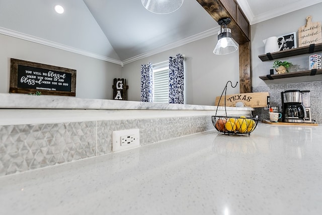 interior space featuring lofted ceiling, tasteful backsplash, and crown molding