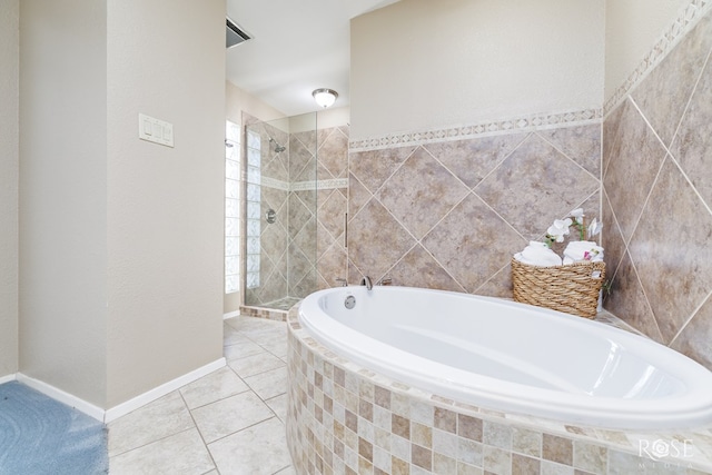 bathroom featuring separate shower and tub and tile patterned flooring